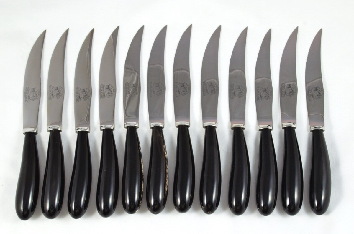 A Set of 12 Sheffield Steak Knives with Water Buffalo Horn Handles