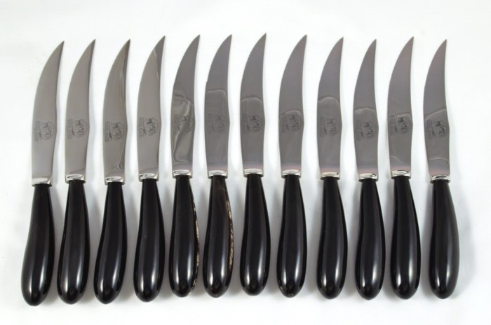 A Set of 12 Sheffield Steak Knives with Water Buffalo Horn Handles