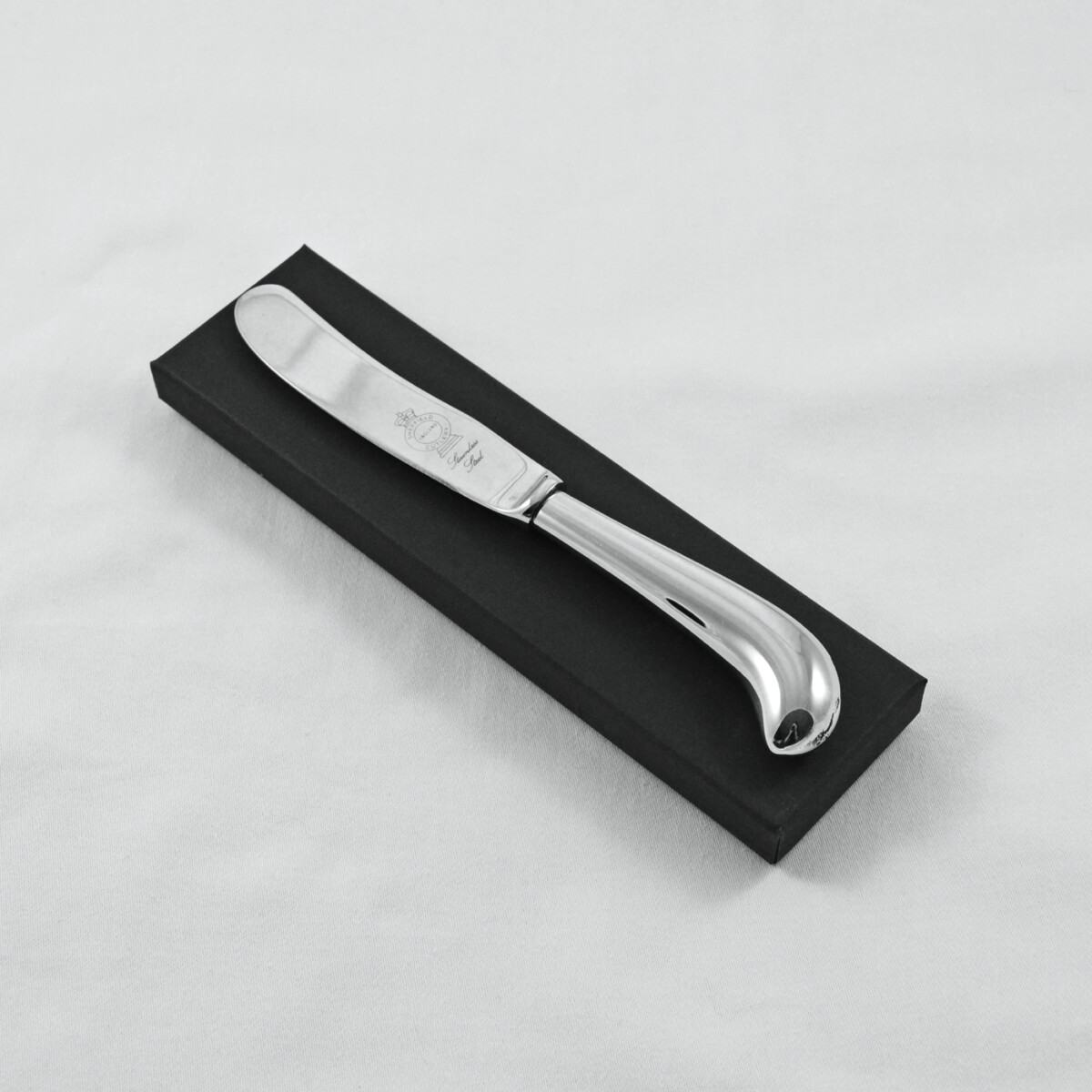 A Pistol Pattern Stainless Steel Butter Knife Gift Boxed And Engraved 'Sheffield, England'