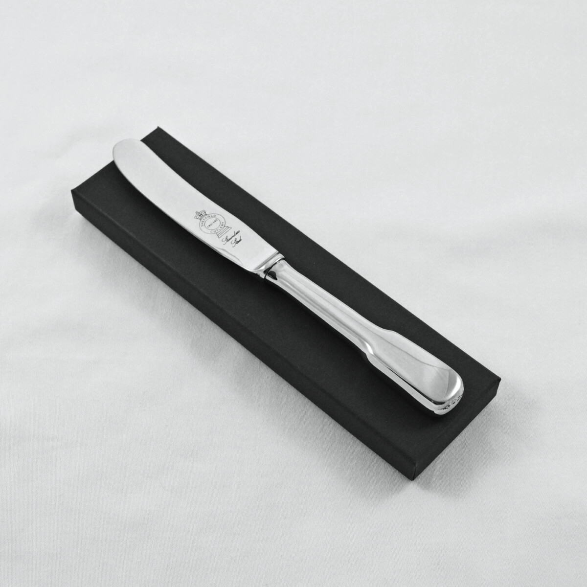 A Fiddle Pattern Stainless Steel Butter Knife Gift Boxed And Engraved 'Sheffield, England'