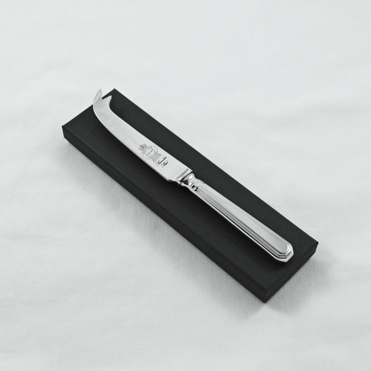 An Athenian Pattern Stainless Steel Cheese Knife Gift Boxed And Engraved 'Sheffield, England'