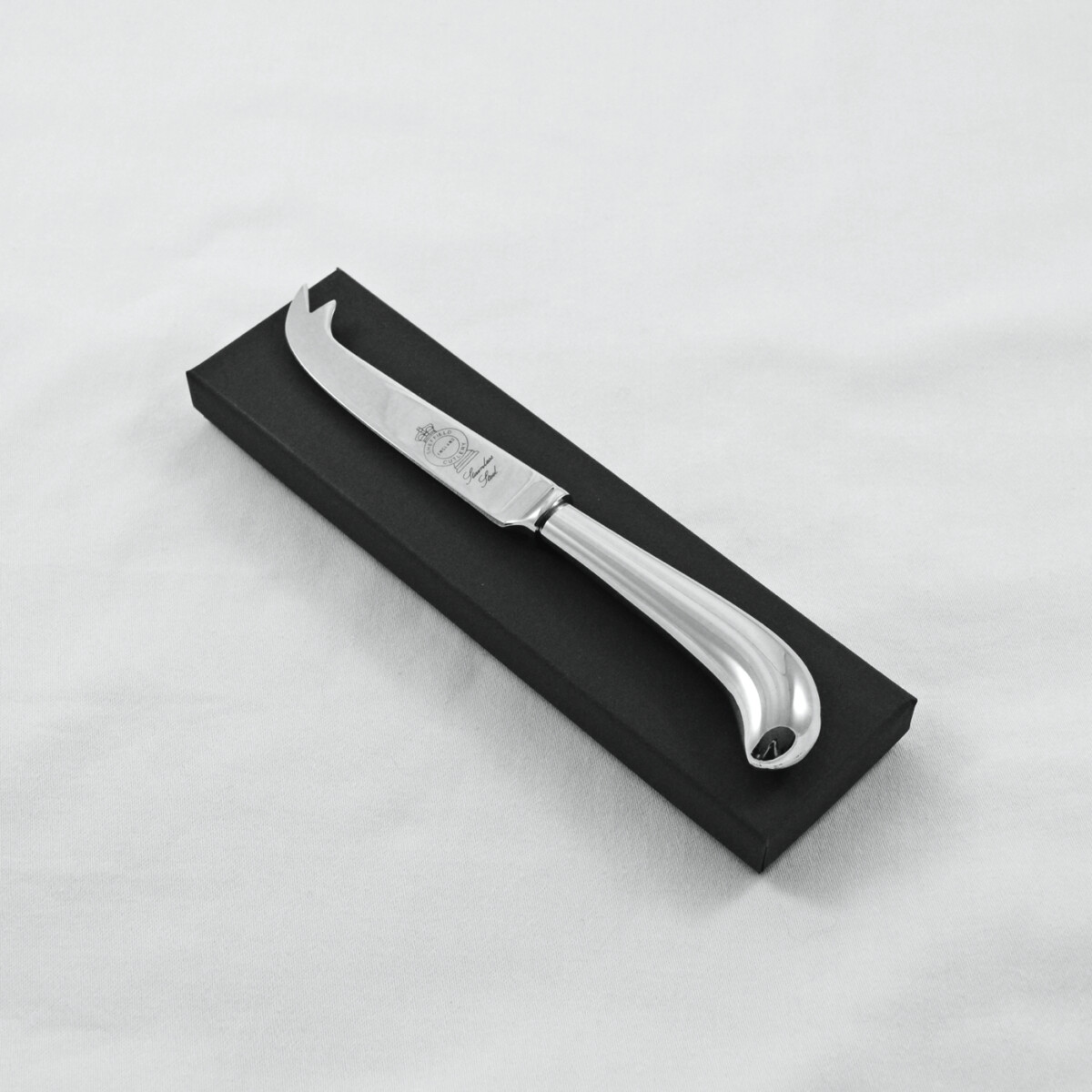 A Pistol Pattern Stainless Steel Cheese Knife Gift Boxed And Engraved 'Sheffield, England'