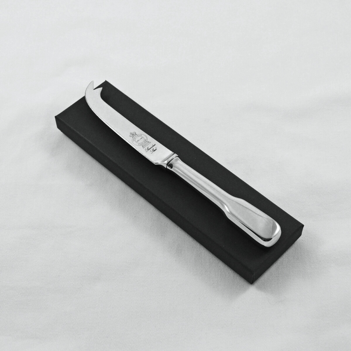 A Fiddle Pattern Stainless Steel Cheese Knife Gift Boxed And Engraved 'Sheffield, England'