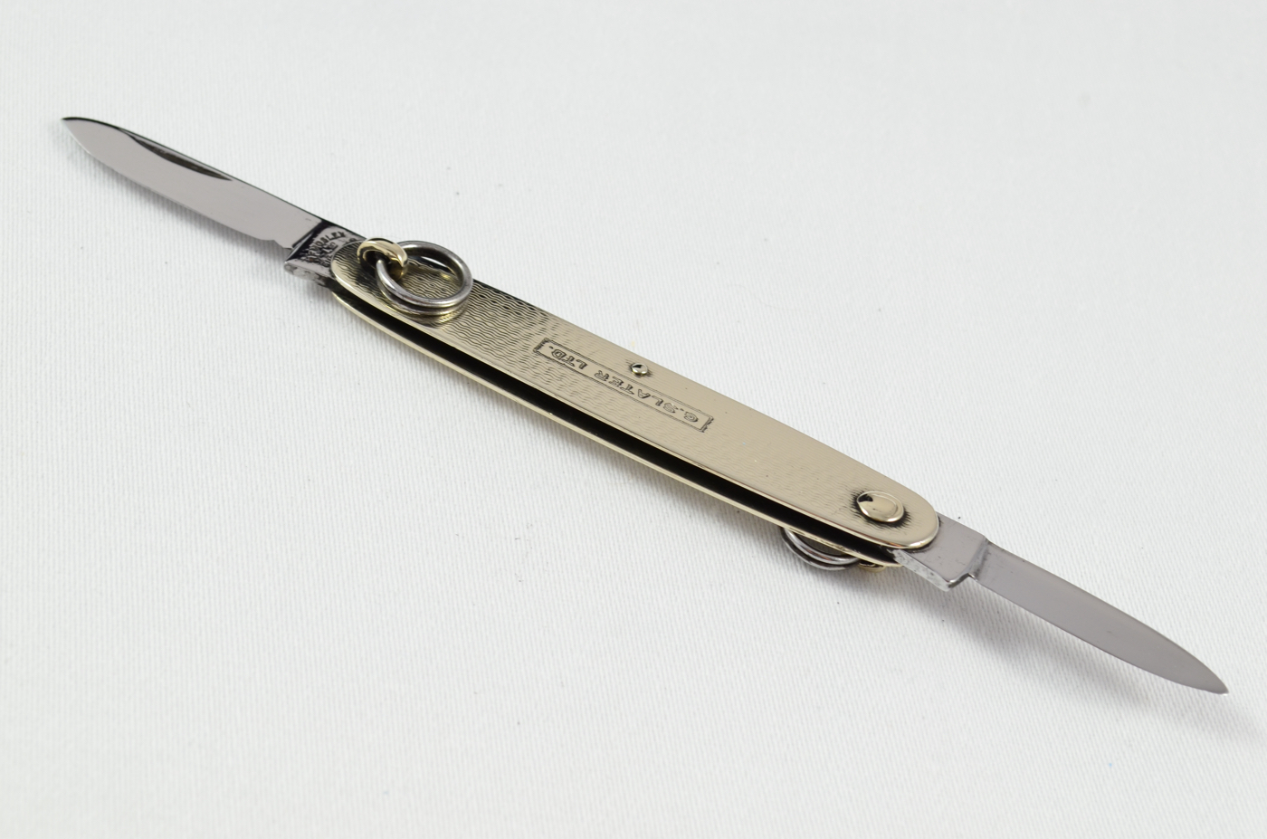 An RFM Folding Engine Turned Nickel Advertisement Ring Pocket Pen Knife Sheffield