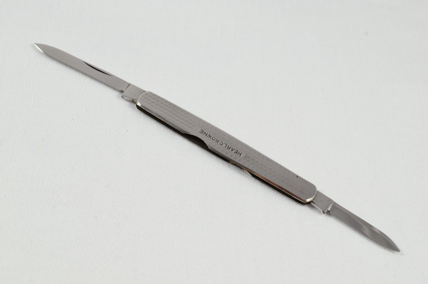 A John Brookes Stainless Steel Engine Turned Advertisement Pocket Pen Knife
