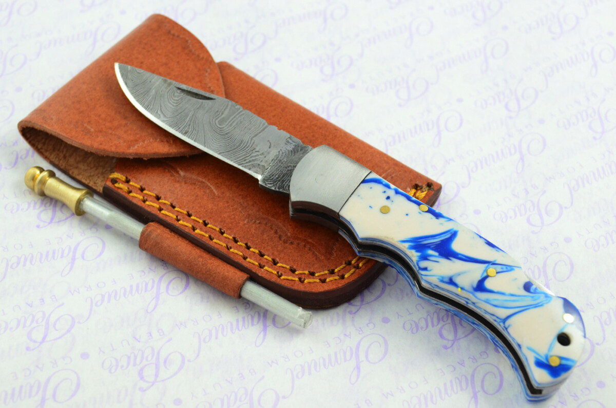 A Handmade Damascus Steel Pocket Knife - Blue & White Resin Scales