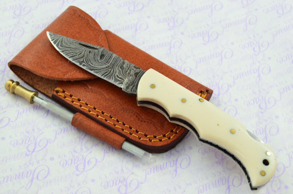 A Handmade Damascus Steel Pocket Knife - Cream Resin Scales