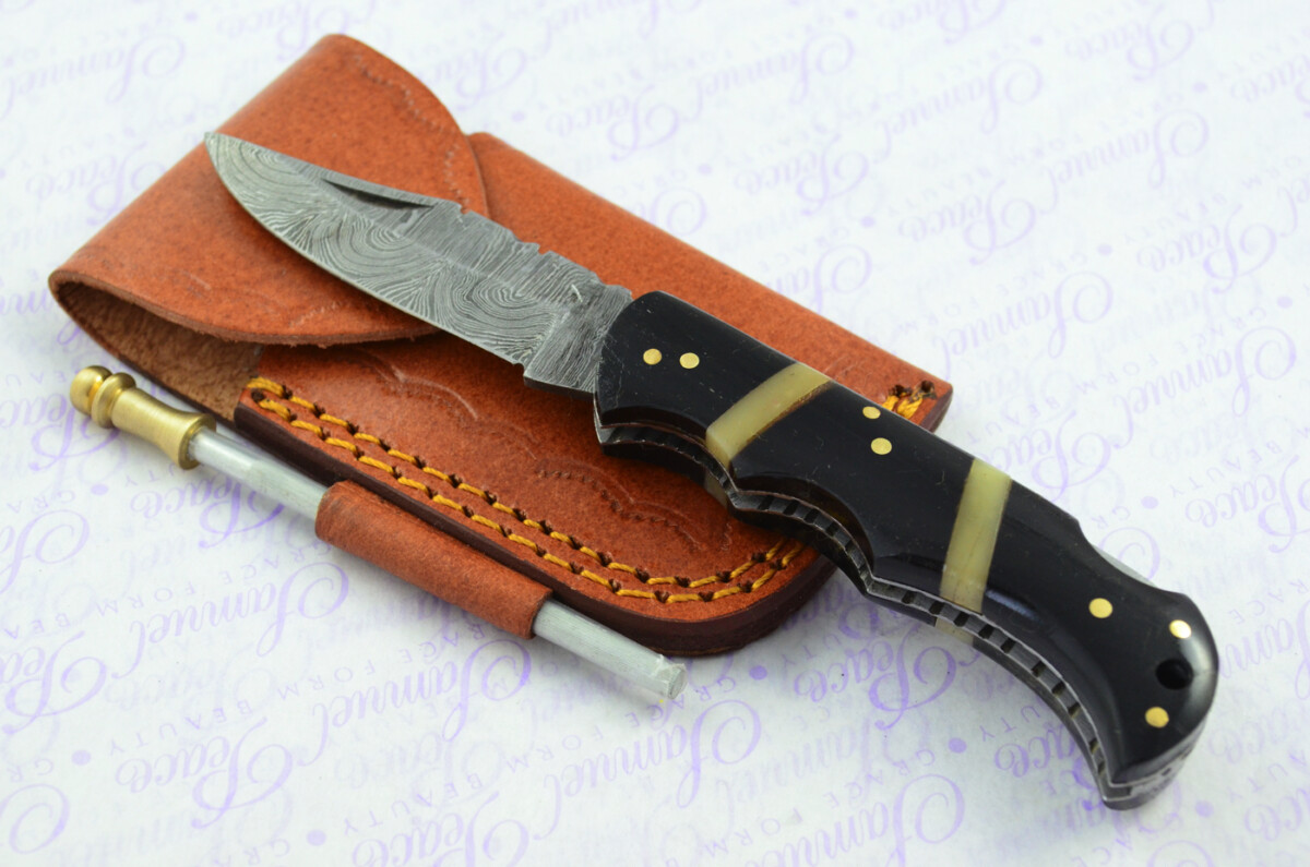 A Handmade Damascus Steel Pocket Knife - Resin Scales