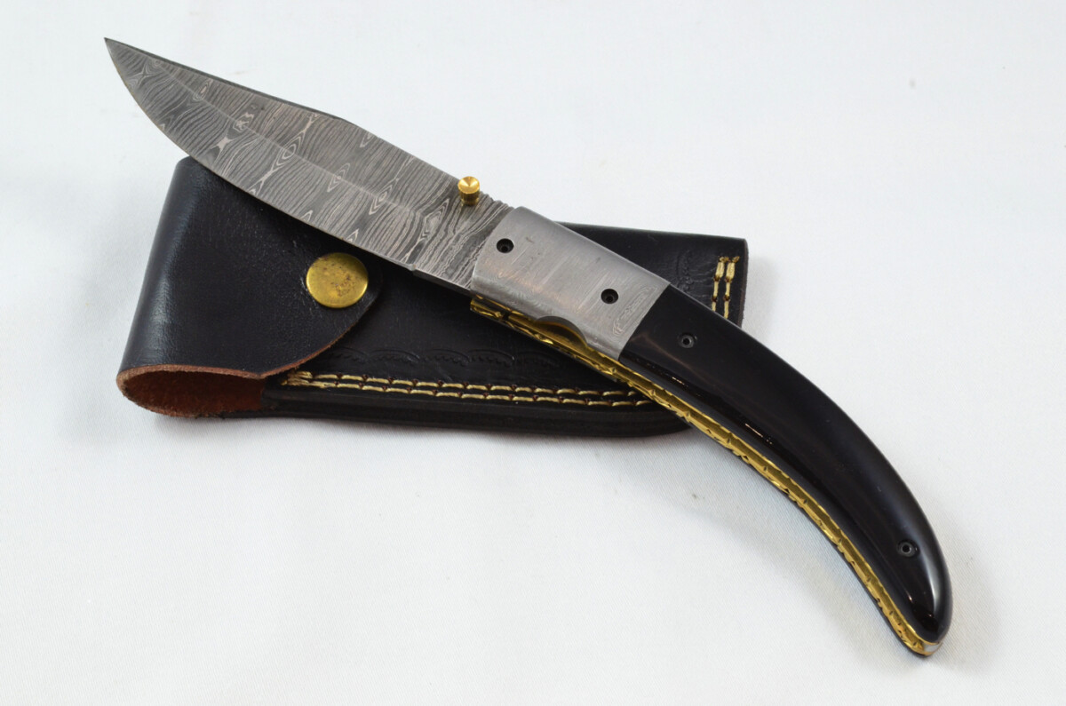 A Huge Beautiful Handmade Damascus Steel Bladed Buffalo Scaled Pocket Knife