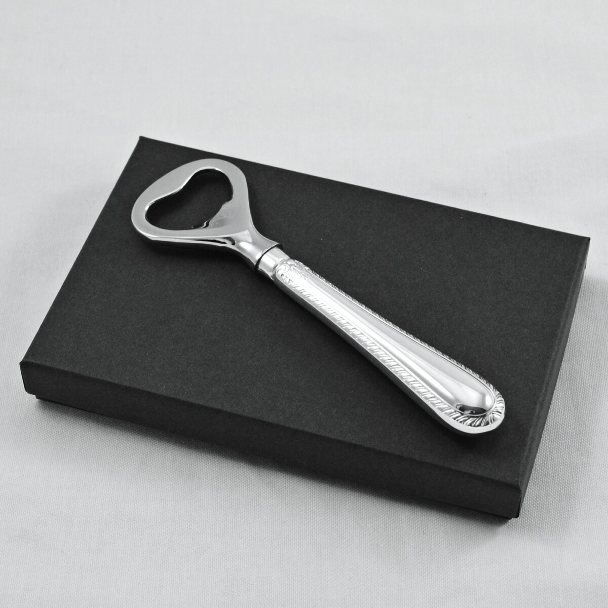 A Feather Edge Pattern Silver Plated Bottle Opener Gift Boxed